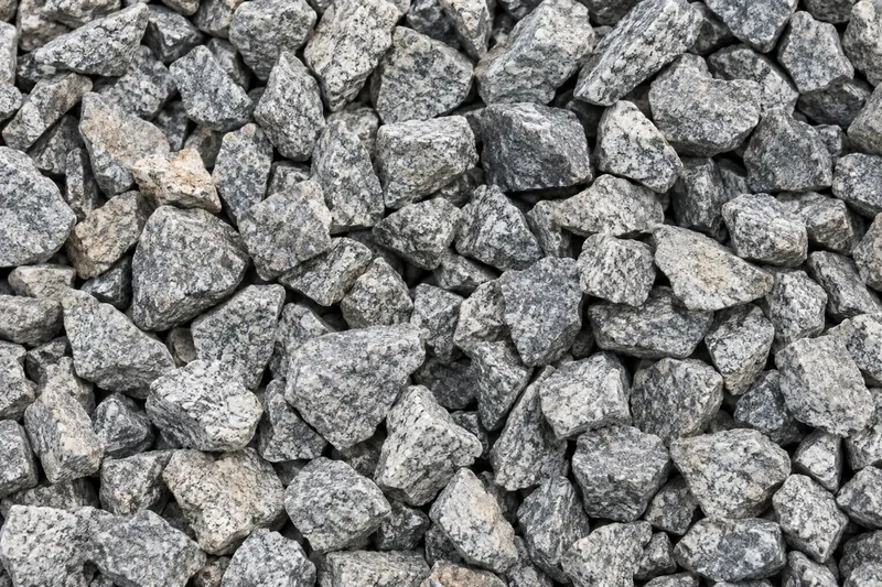 Clean angular crushed stone with open spaces and few fines