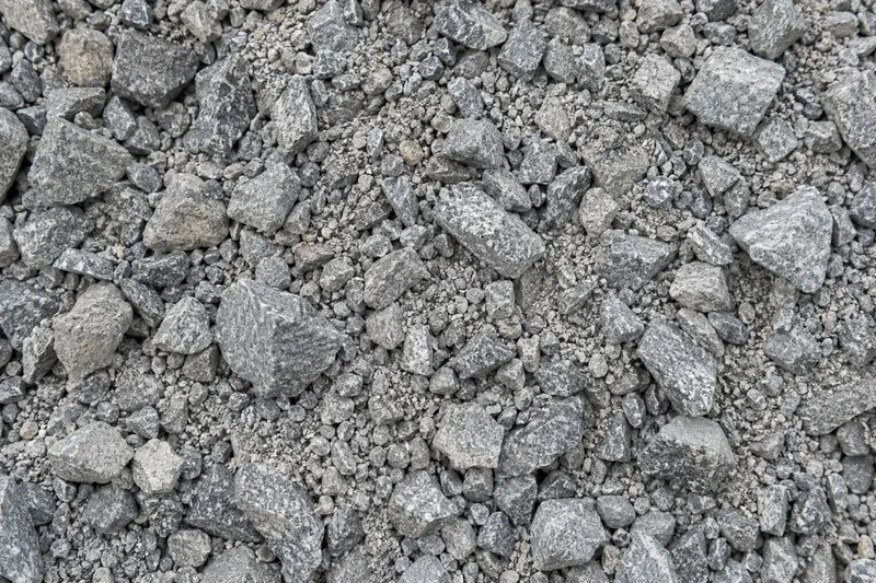 Angular crushed aggregate with smaller particles and fines