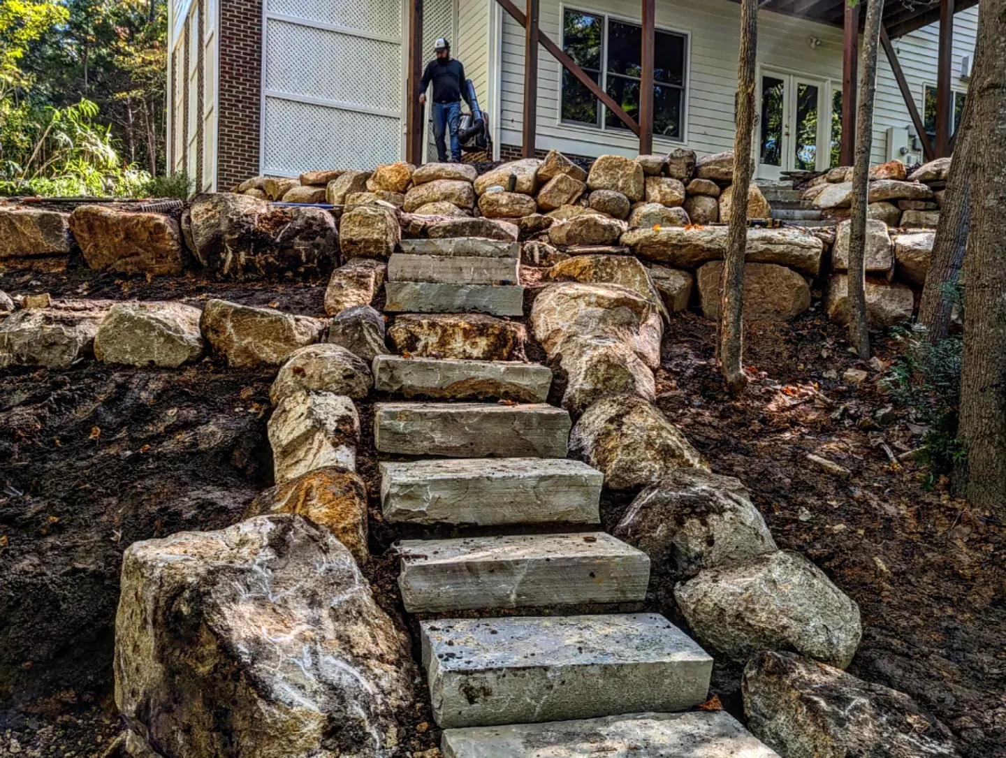 Natural boulder stairway built into a sloped residential yard in Chapel Hill