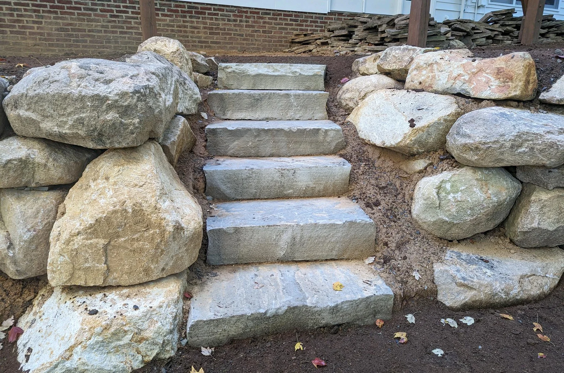 Natural stone steps and outdoor seating area
